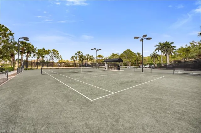 an aerial view of a house with a garden and lake view