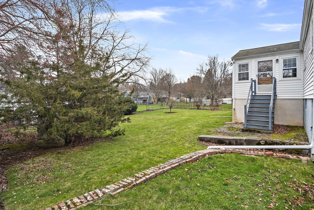 22 Anna Road Woburn, MA 01801 - Photo 28 of 37 a view of a house with a yard