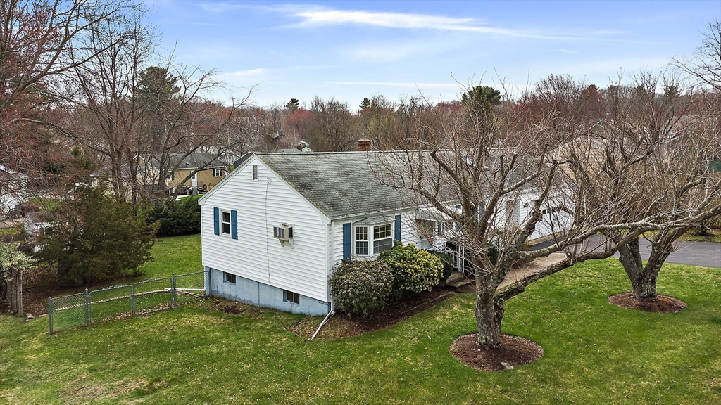 22 Anna Road Woburn, MA 01801 - Photo 33 of 37 a view of a house with a backyard