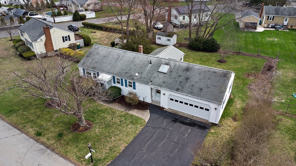 22 Anna Road Woburn, MA 01801 - Photo 35 of 37 an aerial view of a house with garden space and street view