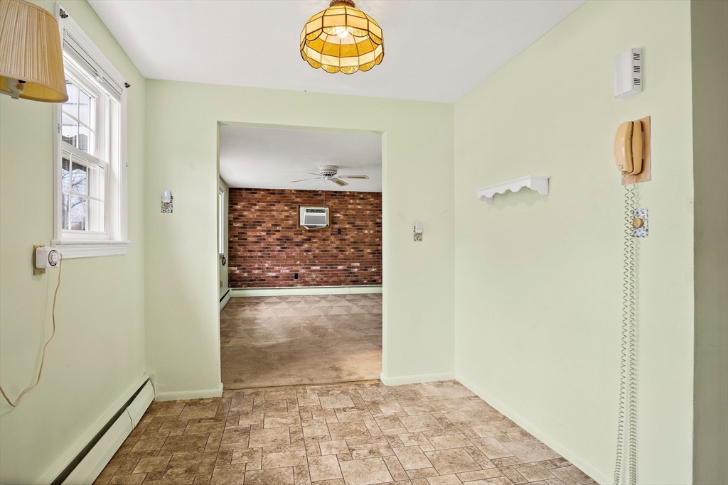 22 Anna Road Woburn, MA 01801 - Photo 7 of 37 a view of an entryway with wooden floor