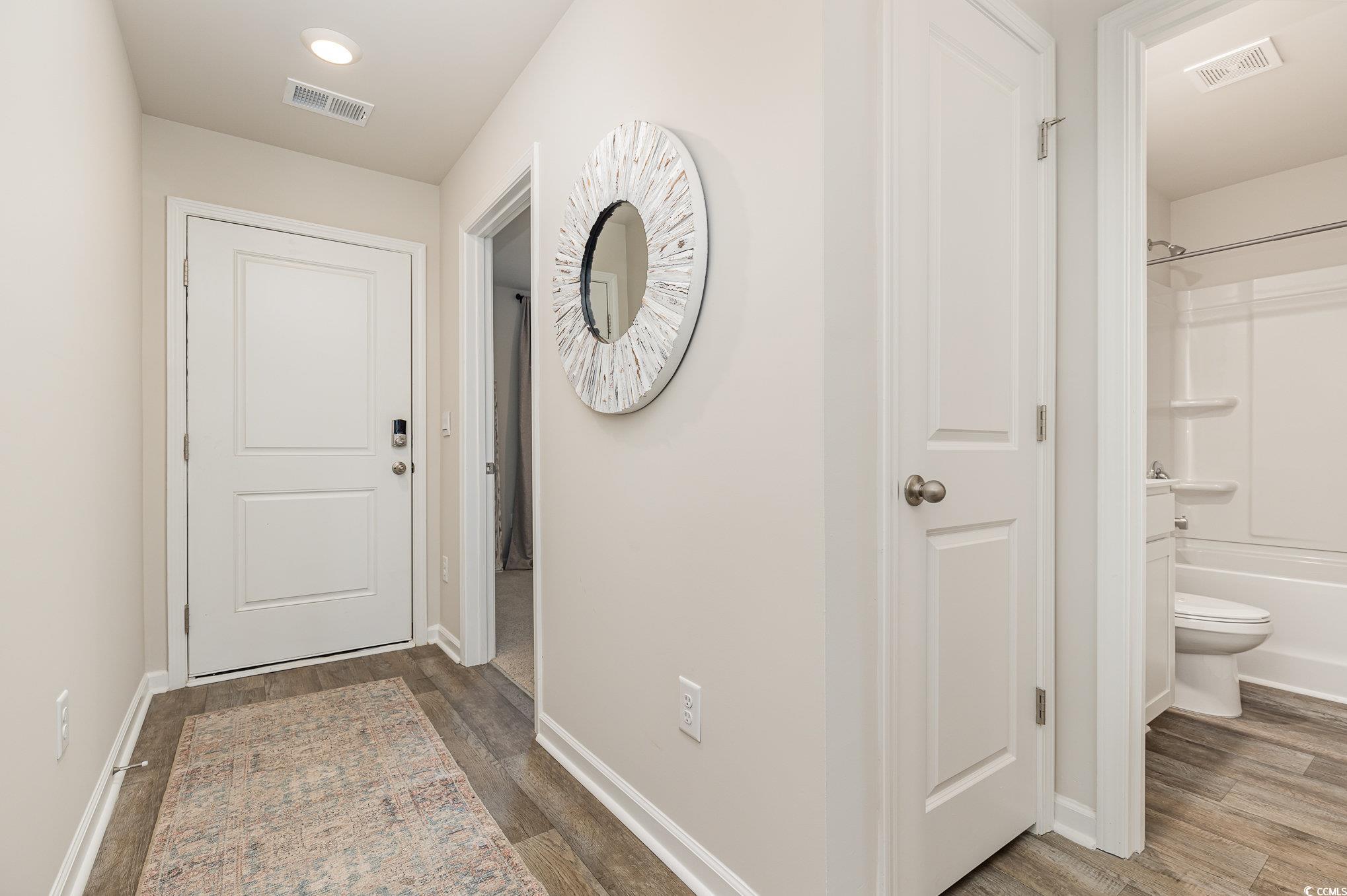 866 Farmers Passage Loop Loris, SC 29569 - Photo 2 of 25 Entryway with wood finished floors and baseboards