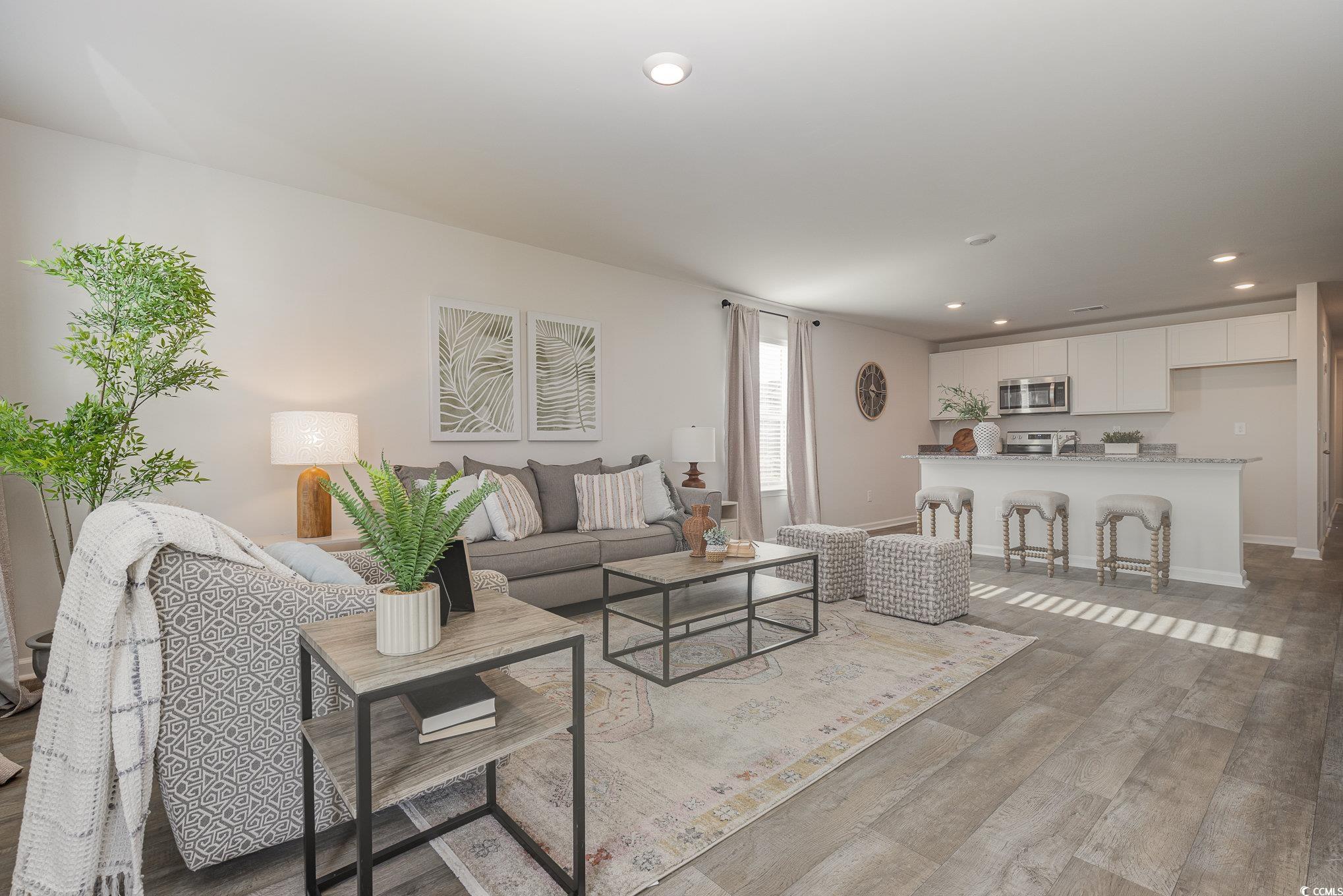 866 Farmers Passage Loop Loris, SC 29569 - Photo 7 of 25 Living area with light wood-style flooring and recessed lighting