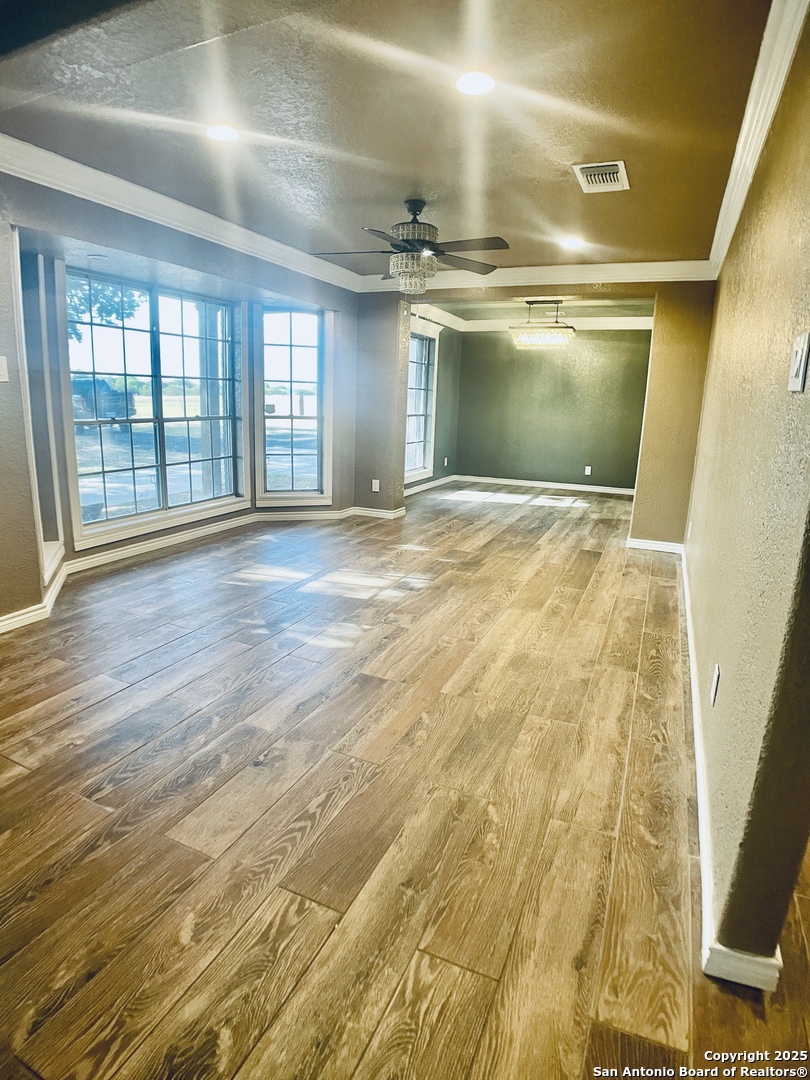 3010 Triple Tree Drive China Grove, TX 78263 - Photo 9 of 18 a view of empty room with wooden floor