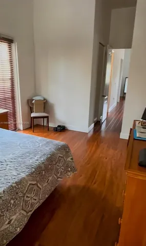 a view of a livingroom with furniture and staircase