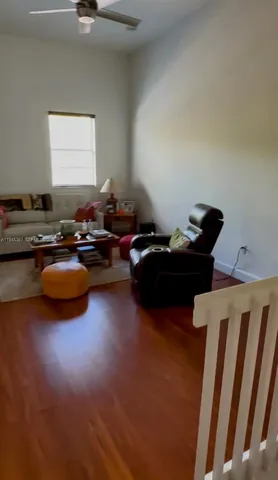 a living room with furniture window and couch