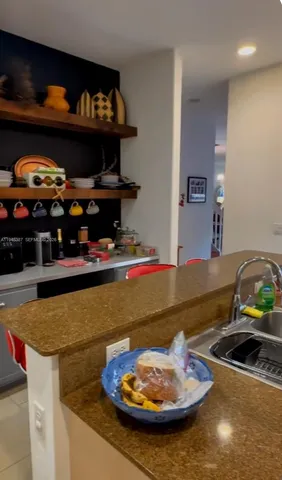 a room with water heater and wooden floor