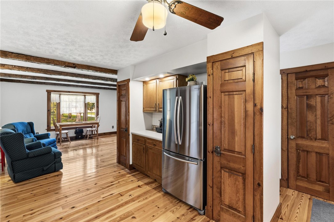 4971 Lackey Road Cedarville, OH 45314 - Photo 27 of 79 This inviting interior features rustic wood floors and charming natural wood accents throughout.
