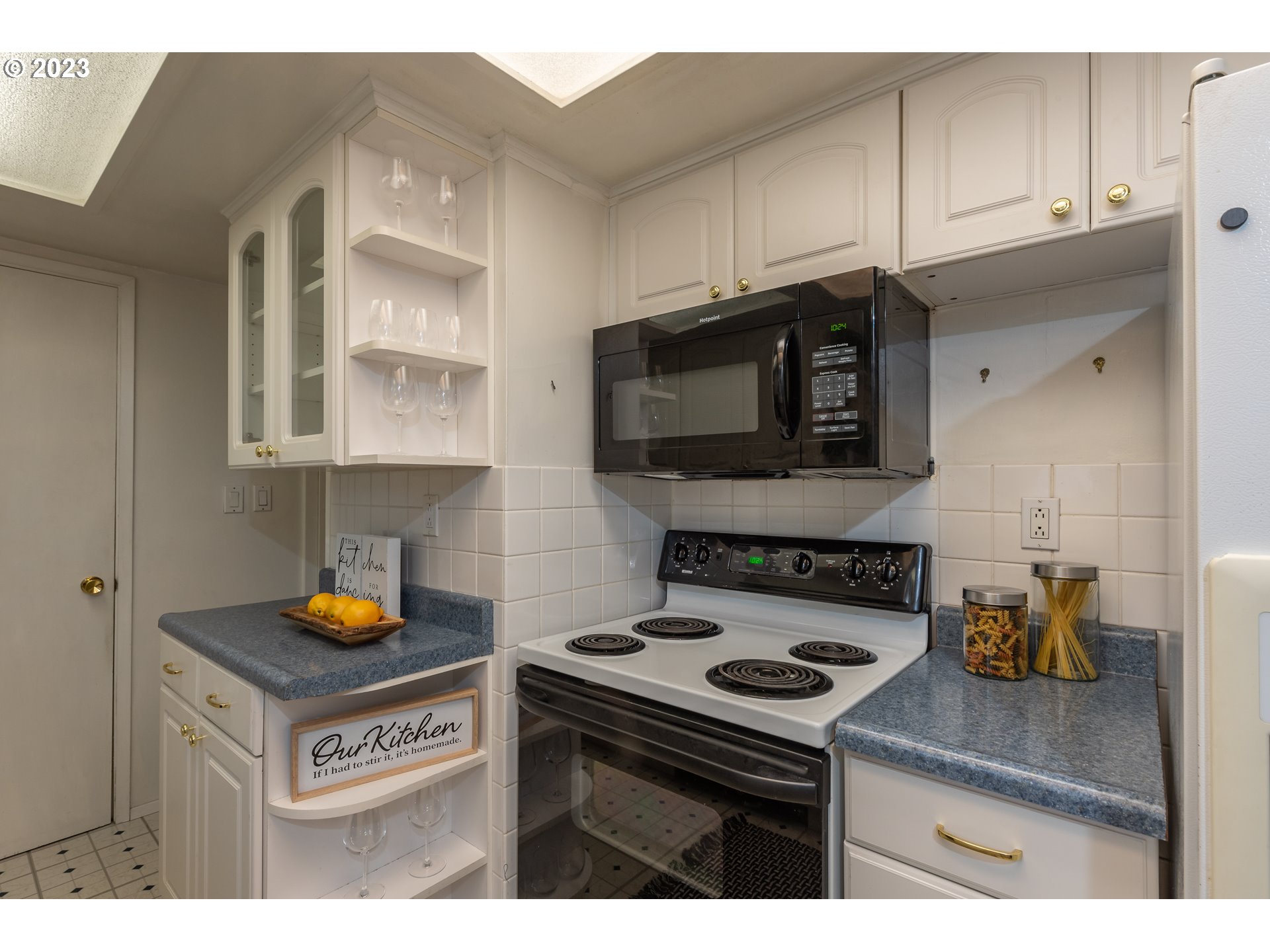 2434 Southwest 328th Street Federal Way, WA 98023 - Photo 14 of 31 a kitchen with a stove and a microwave