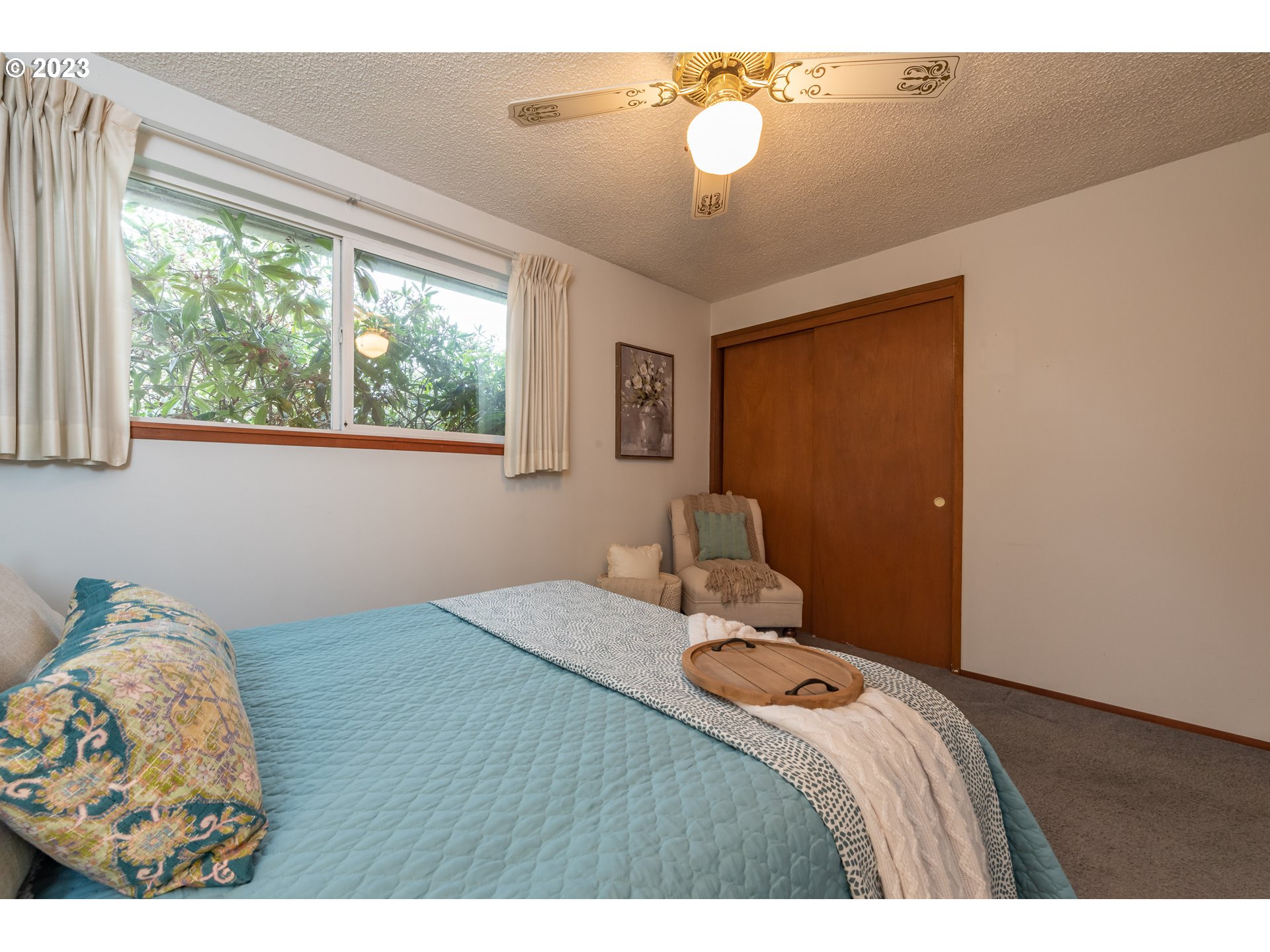 2434 Southwest 328th Street Federal Way, WA 98023 - Photo 20 of 31 a bedroom with a bed and a chandelier