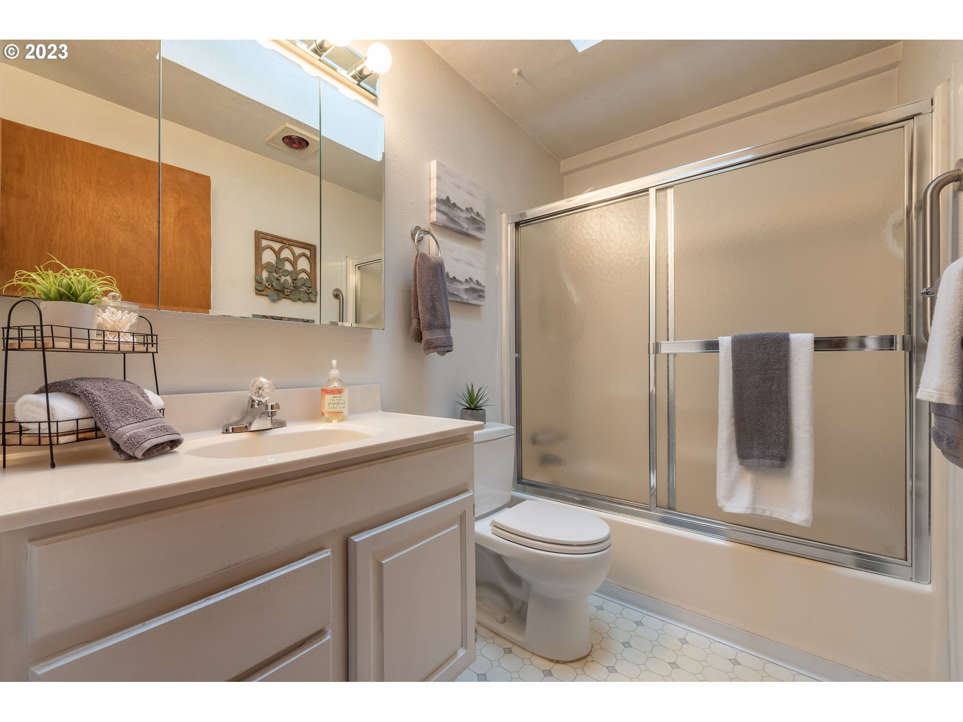 2434 Southwest 328th Street Federal Way, WA 98023 - Photo 23 of 31 a bathroom with a sink a toilet and shower