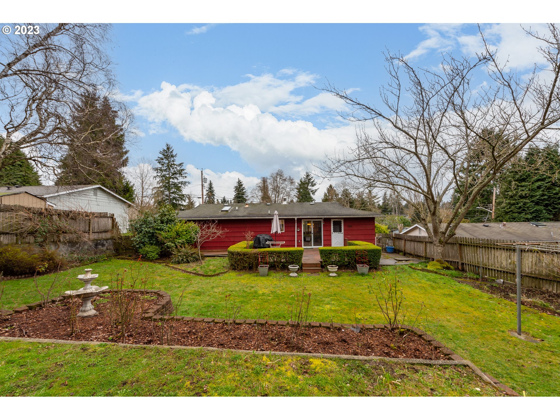 2434 Southwest 328th Street Federal Way, WA 98023 - Photo 29 of 31 a view of a yard with plants and large trees
