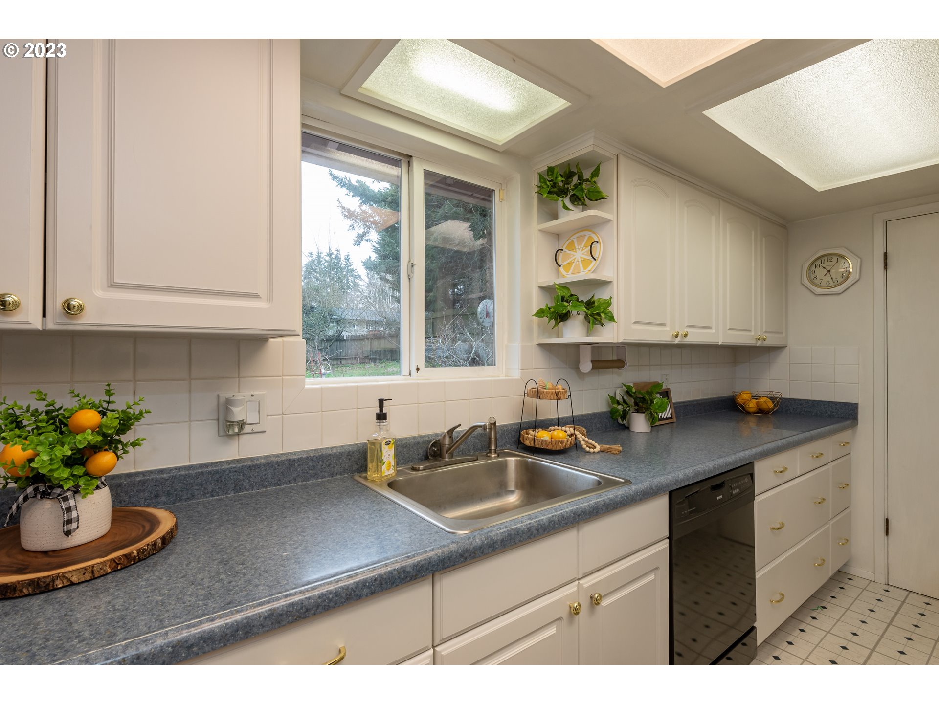 2434 Southwest 328th Street Federal Way, WA 98023 - Photo 10 of 31 a kitchen with a sink and cabinets