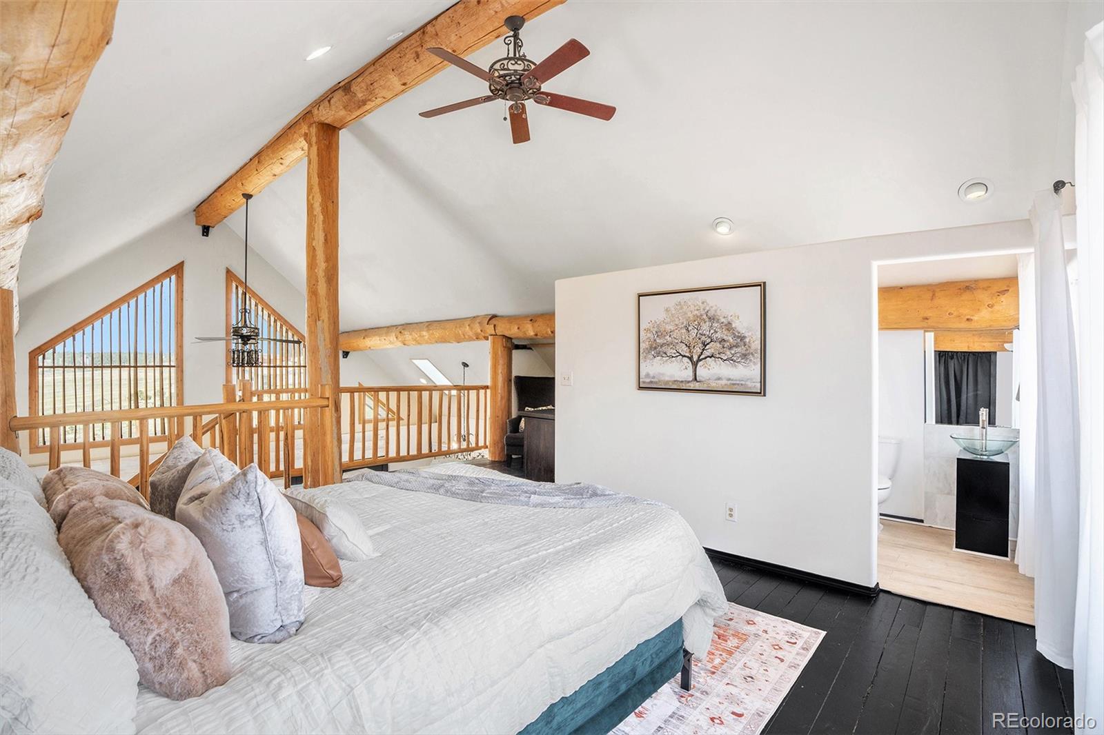 13485 Woodlake Road Elbert, CO 80106 - Photo 12 of 25 a bedroom with a bed and a window
