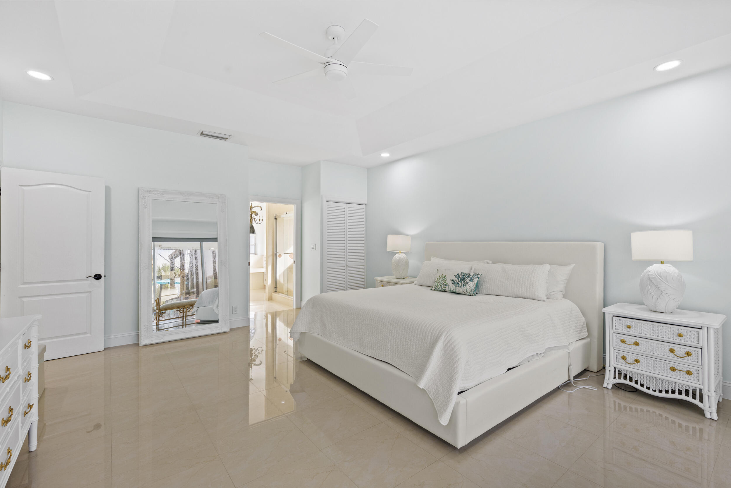 10431 Stonebridge Boulevard Boca Raton, FL 33498 - Photo 18 of 52 a bedroom with a bed and a night stand