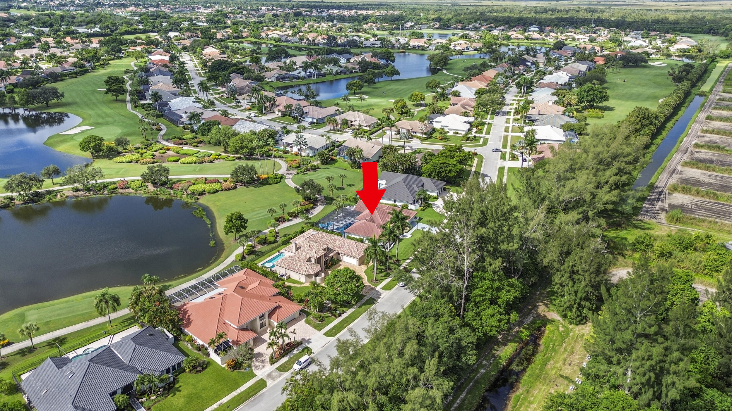 10431 Stonebridge Boulevard Boca Raton, FL 33498 - Photo 43 of 52 an aerial view of residential houses with outdoor space and trees