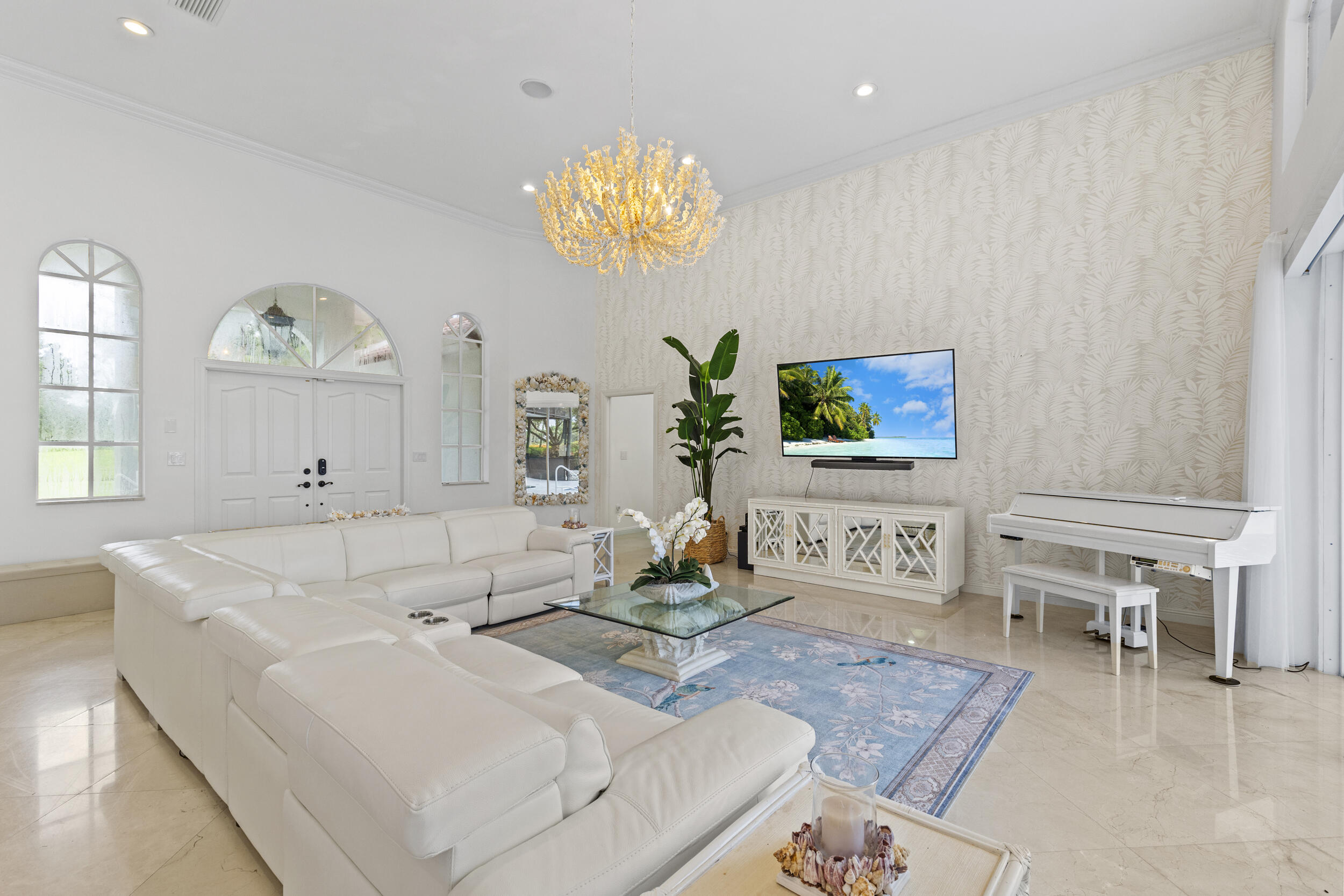 10431 Stonebridge Boulevard Boca Raton, FL 33498 - Photo 6 of 52 a living room with furniture chandelier and a window