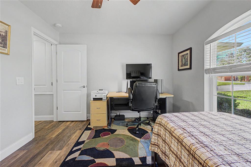 11213 Flock Avenue Weeki Wachee, FL 34613 - Photo 33 of 46 a bedroom with a workspace