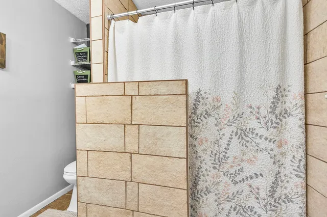 a bathroom with a shower curtain