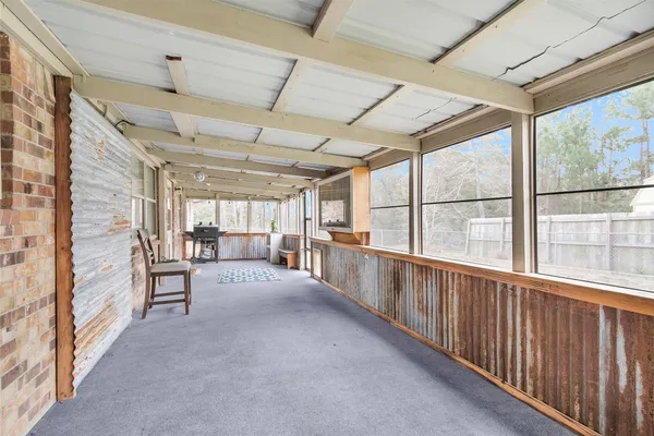 a view of a porch with furniture