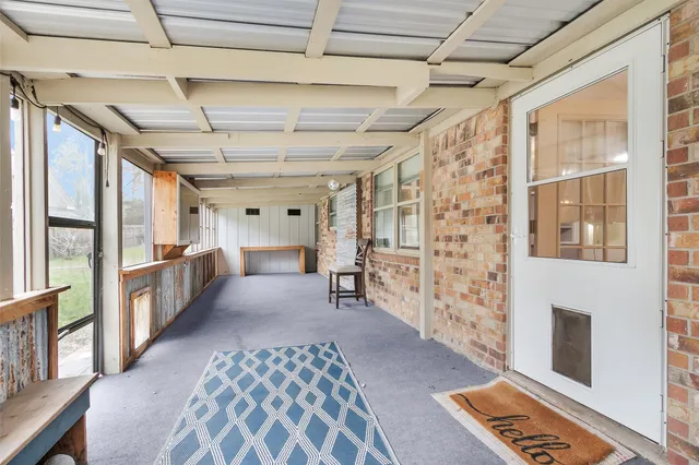 a view of a hallway with windows