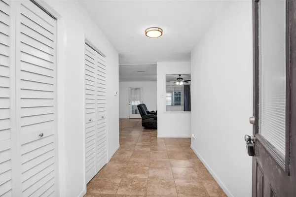a view of a livingroom with furniture and closet