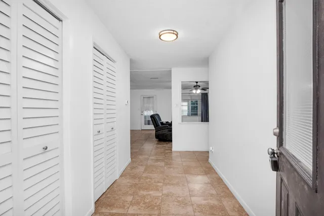 a view of a livingroom with furniture and closet