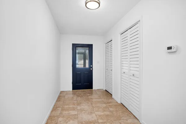 a view of a livingroom from a hallway
