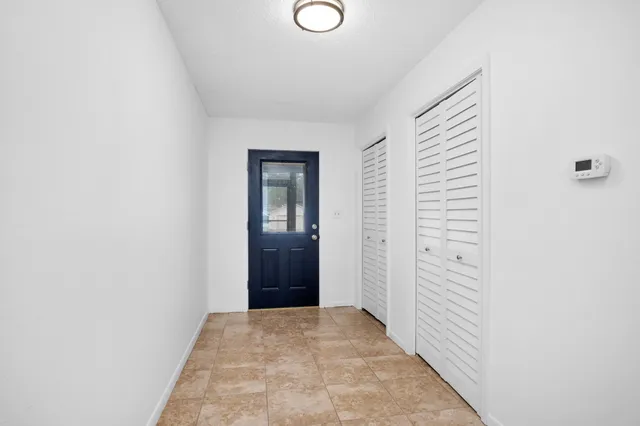 a view of a livingroom from a hallway
