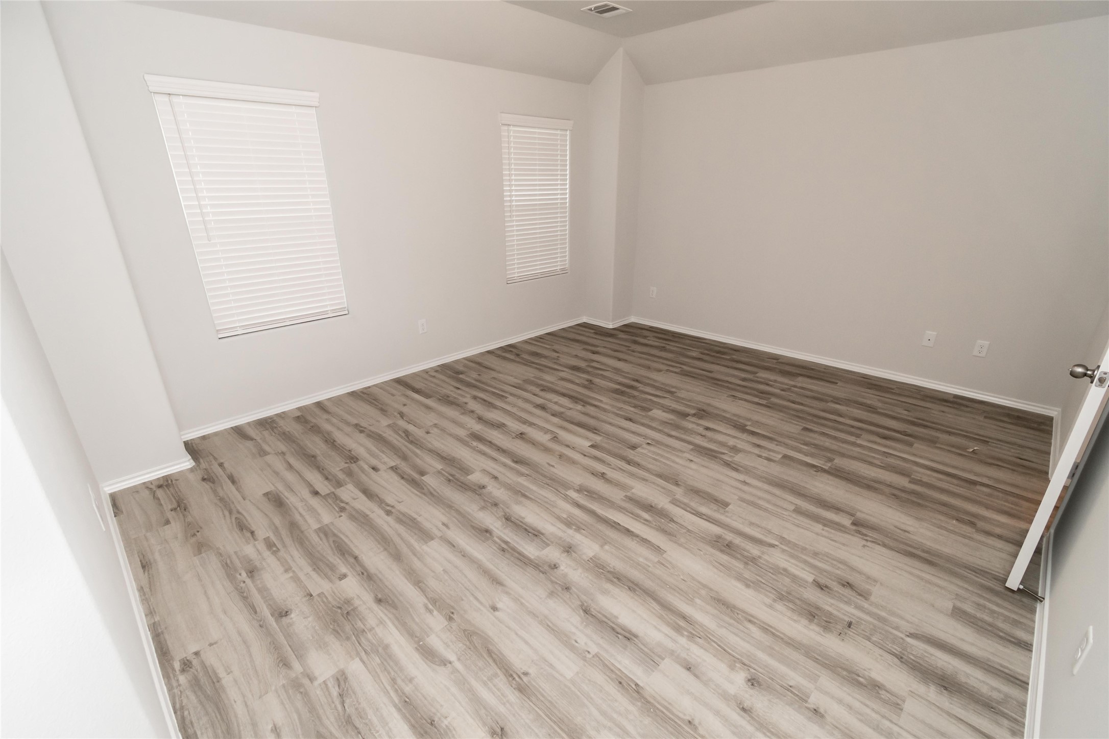18607 Bell Ravine Drive Katy, TX 77449 - Photo 8 of 10 a view of empty room with wooden floor
