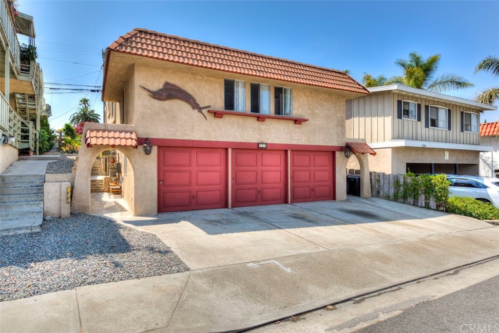 239 Avenida Santa Barbara San Clemente, CA 92672 - Photo 2 of 29 a front view of a house with a yard and garage