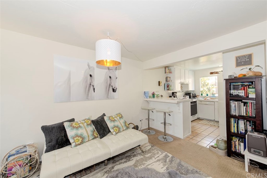 239 Avenida Santa Barbara San Clemente, CA 92672 - Photo 17 of 29 a living room with furniture and a book shelf