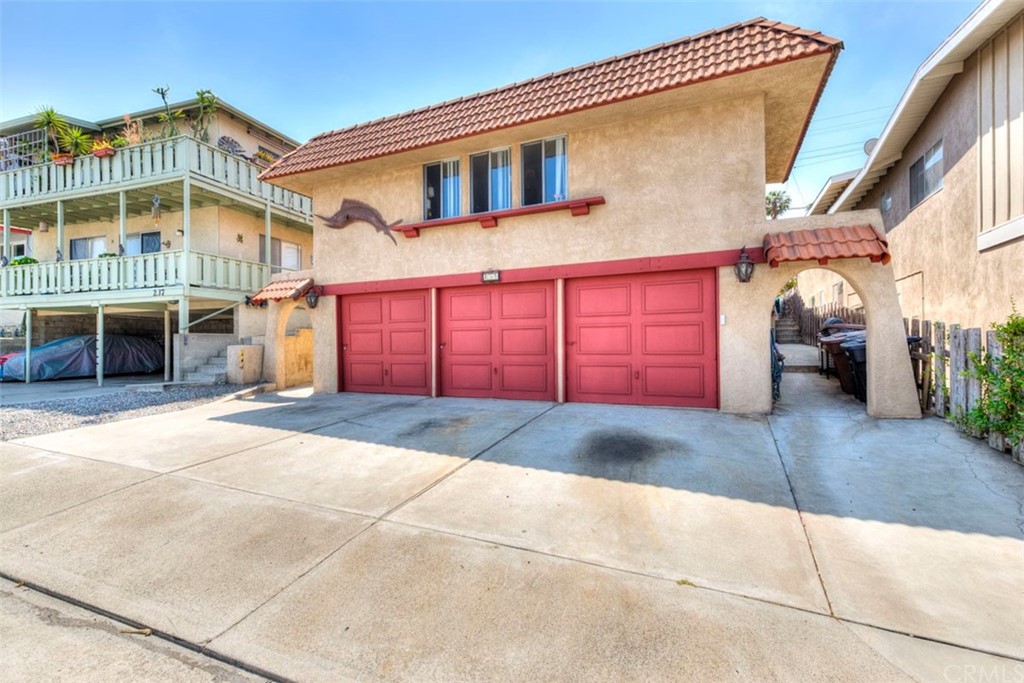 239 Avenida Santa Barbara San Clemente, CA 92672 - Photo 3 of 29 a front view of residential houses with parking