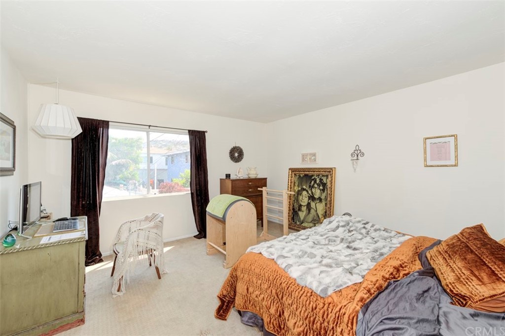 239 Avenida Santa Barbara San Clemente, CA 92672 - Photo 21 of 29 a bedroom with a bed and a large window