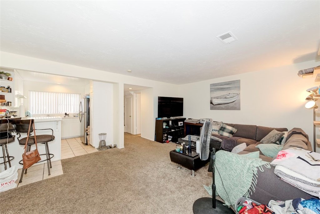 239 Avenida Santa Barbara San Clemente, CA 92672 - Photo 23 of 29 a living room with furniture and a flat screen tv