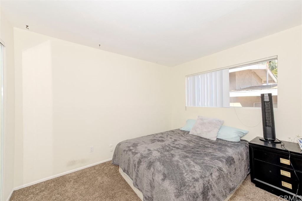 239 Avenida Santa Barbara San Clemente, CA 92672 - Photo 27 of 29 a bedroom with a bed and a night stand