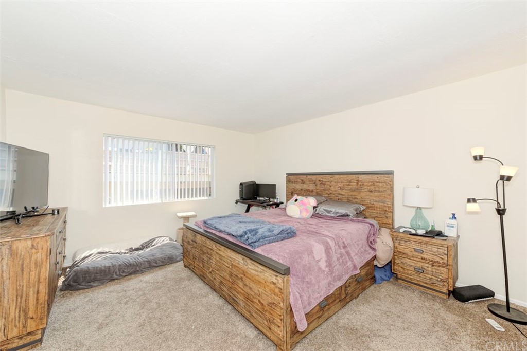 239 Avenida Santa Barbara San Clemente, CA 92672 - Photo 28 of 29 a bedroom with a bed and a flat screen tv