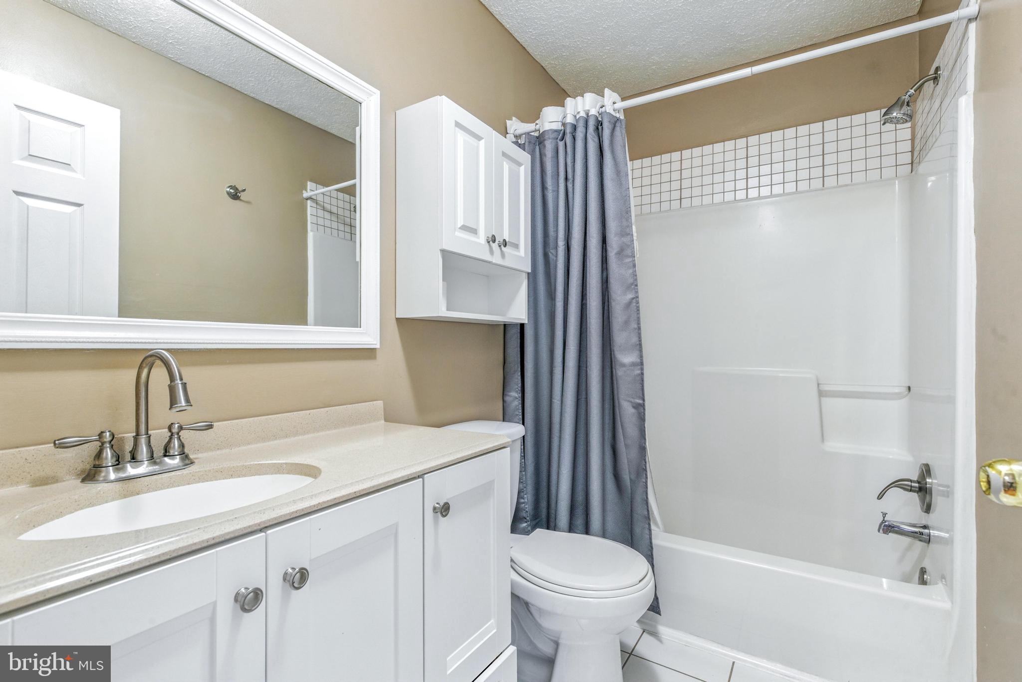 111 Gateway Drive Newark, DE 19711 - Photo 13 of 20 a bathroom with a sink toilet and shower