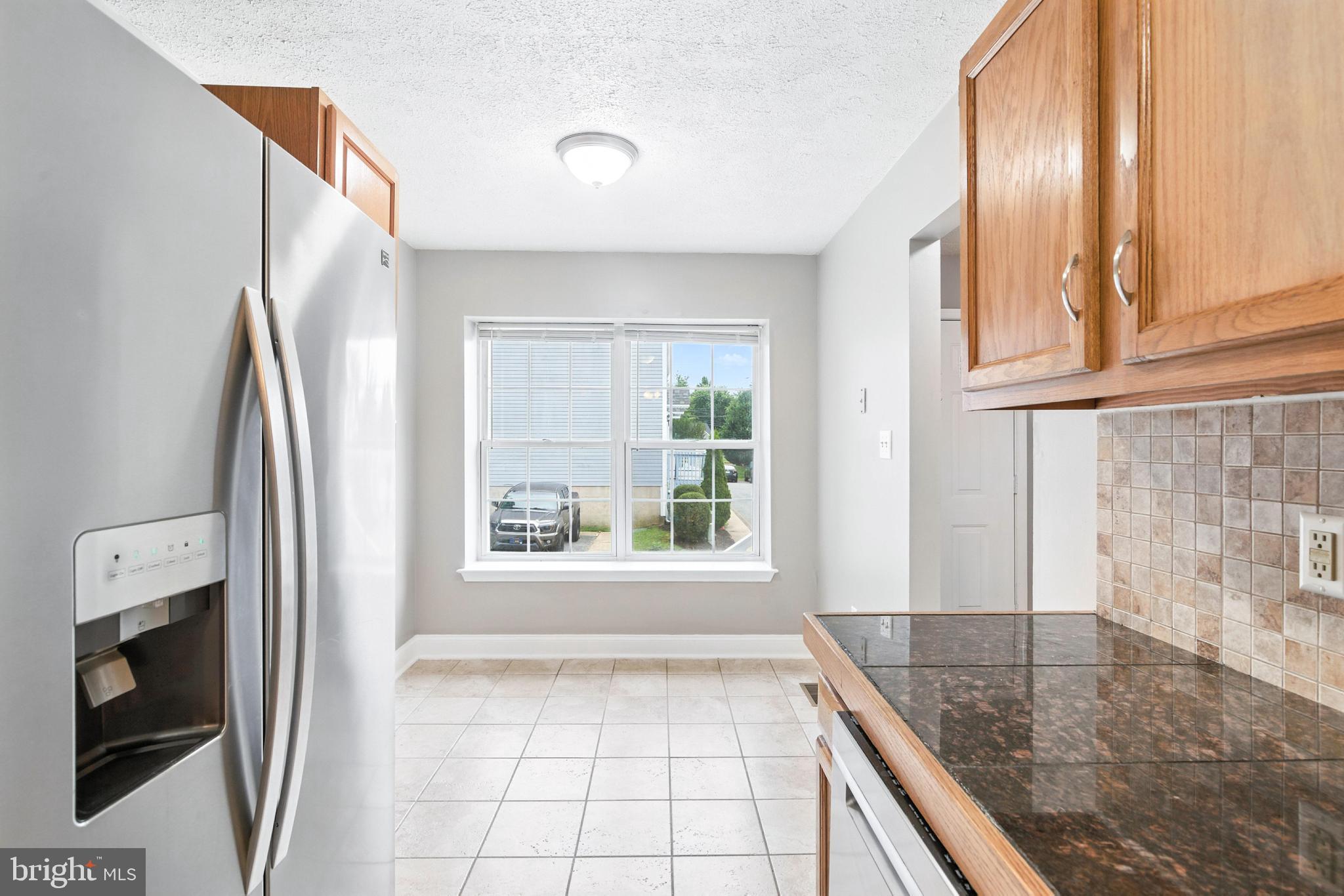 111 Gateway Drive Newark, DE 19711 - Photo 6 of 20 a view of a kitchen cabinets and a window