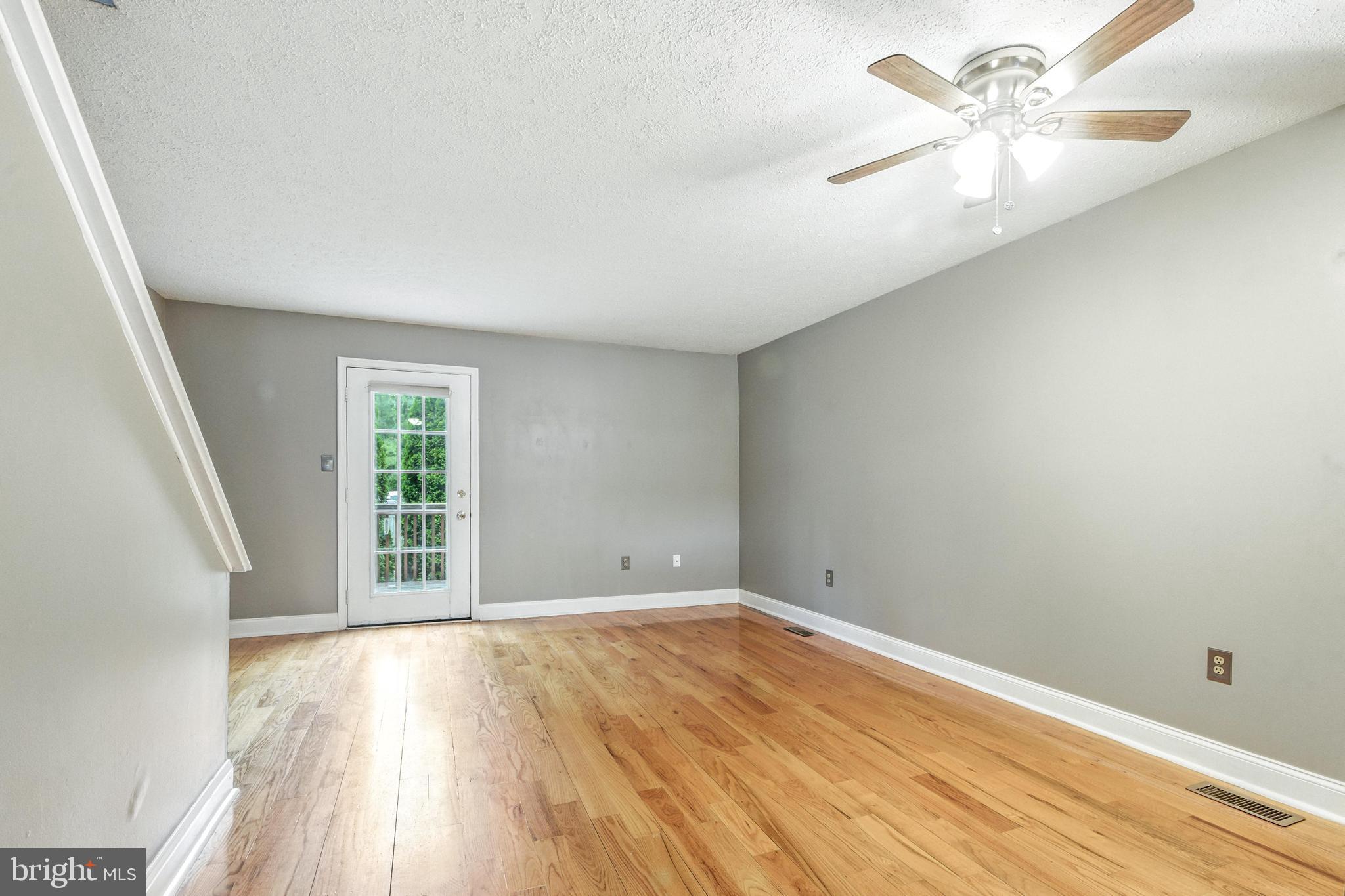 111 Gateway Drive Newark, DE 19711 - Photo 8 of 20 wooden floor in an empty room with a window