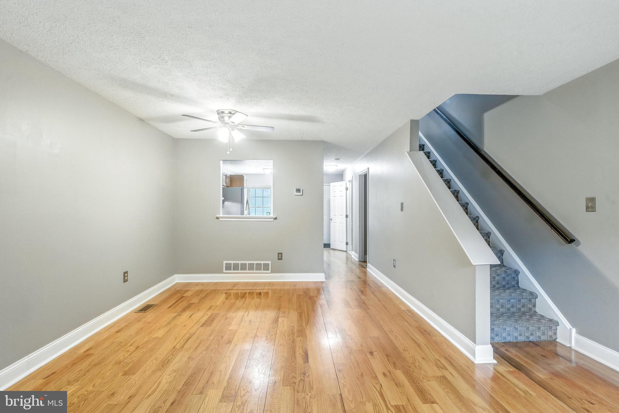 111 Gateway Drive Newark, DE 19711 - Photo 10 of 20 a view of a room with wooden floor and staircase