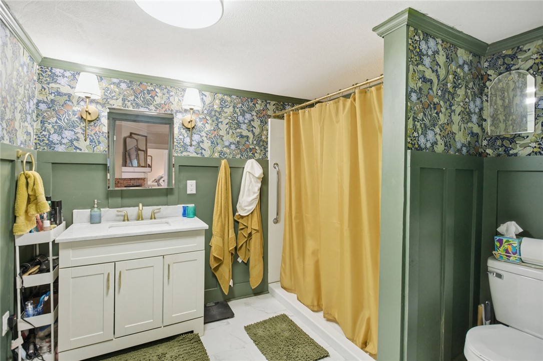 314 South Fairplay Street Seneca, SC 29678 - Photo 23 of 50 This bathroom features a contemporary vanity with a spacious counter and modern fixtures.