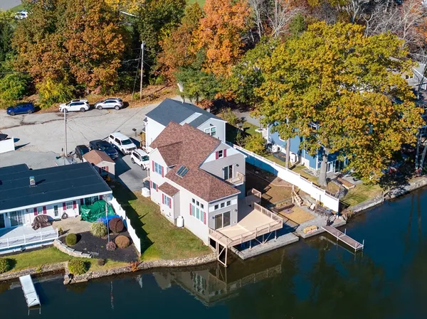 an aerial view of residential houses with outdoor space