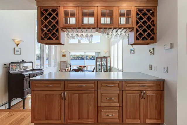 a kitchen with stainless steel appliances granite countertop a sink and cabinets