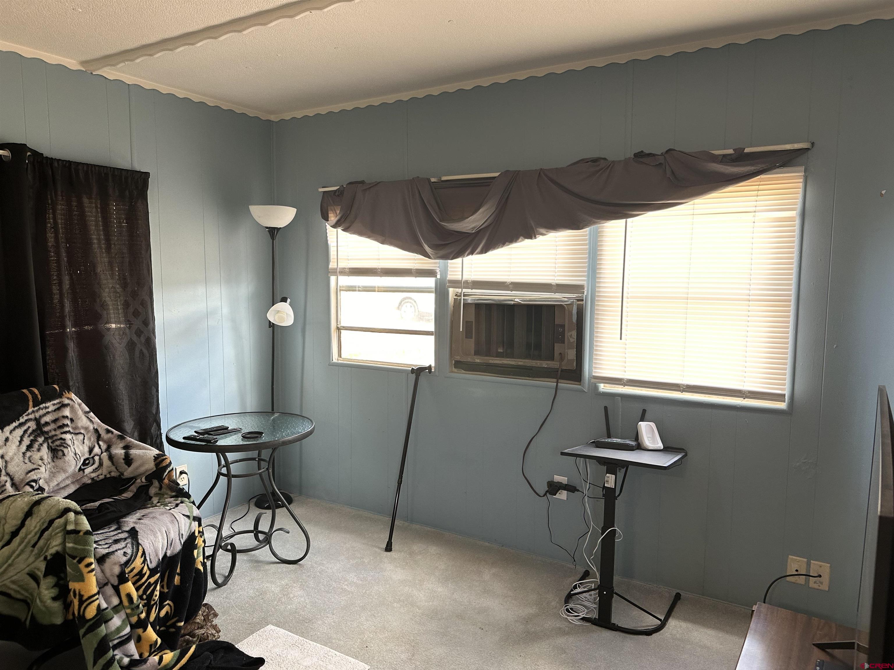609 South Beech Street Cortez, CO 81321 - Photo 3 of 8 a view of a livingroom with furniture and windows