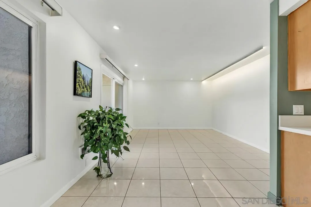 8536 Via Mallorca, Unit B La Jolla, CA 92037 - Photo 9 of 34 a room with a plant and a window