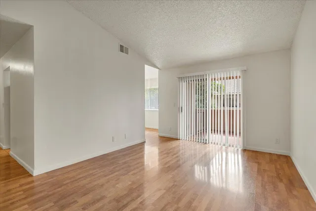 a view of a livingroom with wooden floor