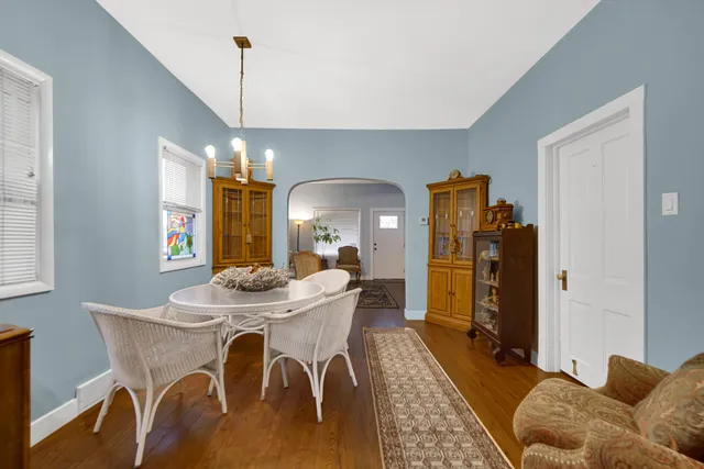 a dining room with furniture and window