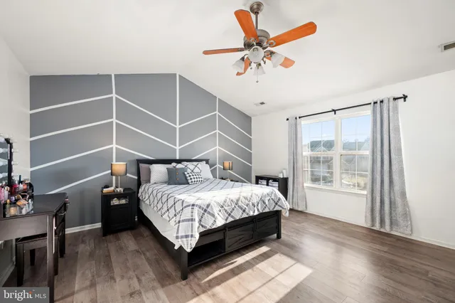 a bed room with a bed and a window