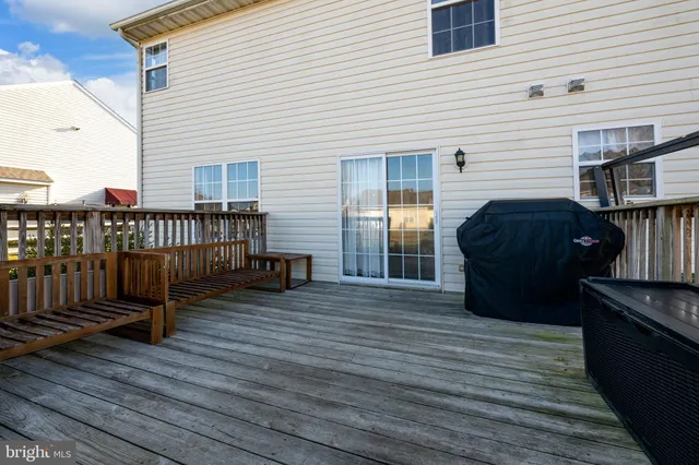 a view of a deck with barbeque grill wooden floor and fence